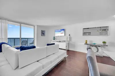 a living room with a white couch and a table at Central ocean view 3 bedrooms in Miami W Parking in Miami