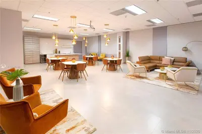 a waiting room with tables and couches and chairs at Ocean view 35th floor, in the heart of Miami in Miami