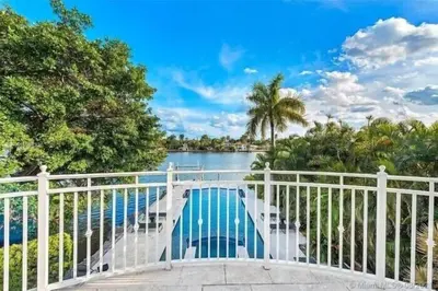 a balcony with a view of a body of water at Hollywood Luxurious Waterfall Villa with Incredible views in Hollywood