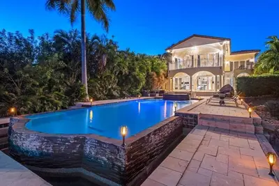 a swimming pool in front of a house at Hollywood Luxurious Waterfall Villa with Incredible views in Hollywood