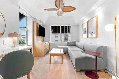 a living room with a couch and a table at Aloha Fridays in Miami Beach