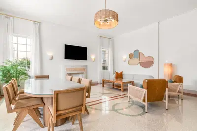 a living room with a table and chairs at Aloha Fridays in Miami Beach