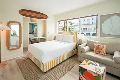 a bedroom with a bed and a couch at Aloha Fridays in Miami Beach