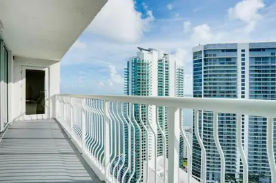 a balcony with a view of some tall buildings at 2BR Penthouse with Unbeatable Water Views and Parking in Miami