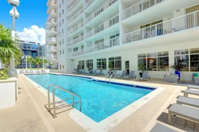 an image of a swimming pool in a building at 2BR Penthouse with Unbeatable Water Views and Parking in Miami