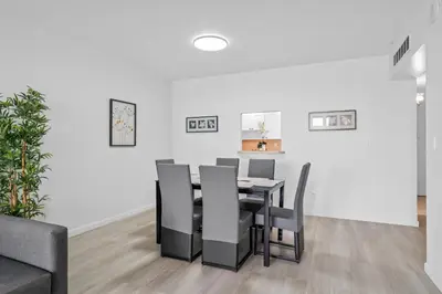 a dining room with a table and chairs at MIAMI Collins Beach Apartments in Sunny Isles Beach