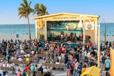 a crowd of people at a concert on the beach at Great Location 5BR Heated Pool near Hollywood Beach in Hollywood