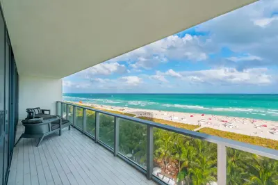 a balcony with a view of the beach at Oceanfront Private Residence at South Beach - 828 in Miami Beach