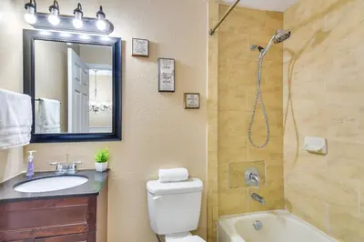 a bathroom with a toilet sink and a shower at Opa-locka Townhome, 15 Mi to Miami Beach! in Opa-locka
