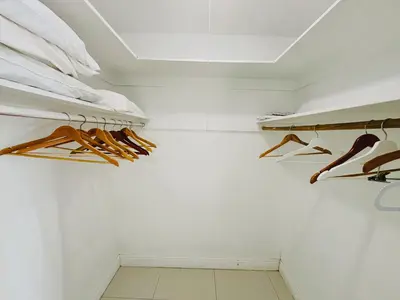 a walk in closet with hangers and shoes at Miami Hollywood Gorgeous 2BD Awesome Ocean View in Hollywood