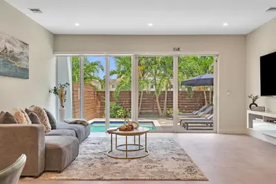 a living room with a couch and a table at Your Dream Home in Coral Ridge in Fort Lauderdale