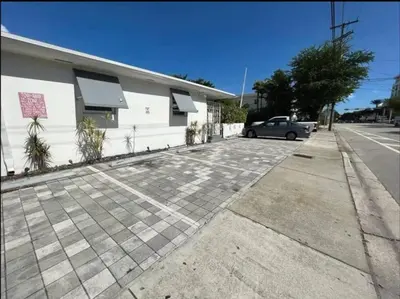 a car parked in a parking lot next to a building at Beautiful Apt 2/2 Near The Beach in Miami