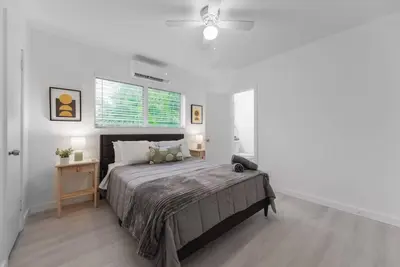 a bedroom with a large bed and a window at Beautiful Apt 2/2 Near The Beach in Miami