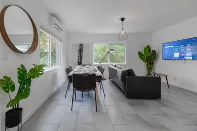 a living room with a table and a couch at Great Apartment 2 BR near the beach in Miami
