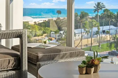 a bedroom with a bed and a view of the ocean at Ocean View Residence at South Beach -514 in Miami Beach
