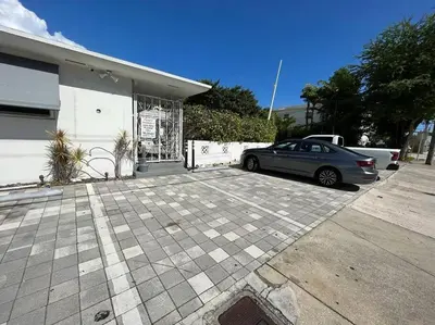 a car parked in a parking lot in front of a garage at Great Studio Residence 15 min from the beach in Miami