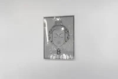 a black and white photo of a face on a wall at Great Studio Residence 15 min from the beach in Miami
