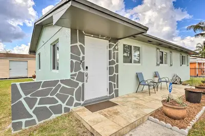 a small house with a stone front door and a patio at Gated Southern Miami Home 22 Mi to Downtown! in Miami