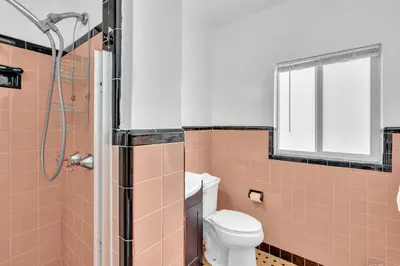 a bathroom with a toilet and a shower at Sea Angel in Hollywood Beach