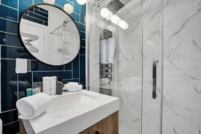 a bathroom with a sink and a mirror at Hollywood Apartments Host by BeeNomad in Hollywood