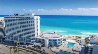 a large building on the beach with the ocean at 11th Miami Beach - Ocean View -Free Valet Parking in Miami Beach