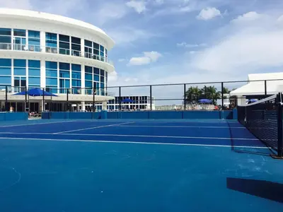 a tennis court in front of a building at 11th Miami Beach - Ocean View -Free Valet Parking in Miami Beach