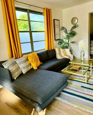 a living room with a couch and a glass table at Lush tropical big home close to Airport, Calle 8, Coral Gables and lots more Miami amenities in Miami