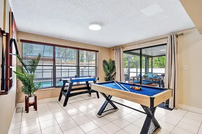 a billiard room with a pool table in it at Deluxe 5BR Villa Heated Pool near Hollywood Beach in Hollywood
