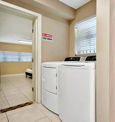 a laundry room with a washer and dryer at Deluxe 5BR Villa Heated Pool near Hollywood Beach in Hollywood