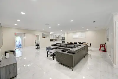 a large living room with a couch and a table at Premium Luxury 5BR Villa near Hollywood Beach in Hollywood