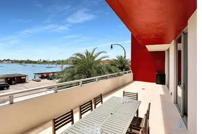 a balcony with a bench and a view of the water at Front Bay View Terrace Rooftop Pool Near Beach in Hollywood