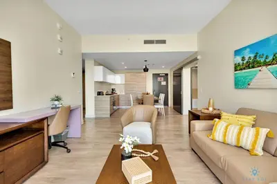 a living room with a couch and a table at Front Bay View Terrace Rooftop Pool Near Beach in Hollywood