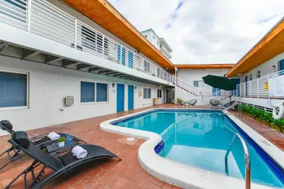 a swimming pool in the backyard of a house at Beachfront Getaway Studio with Parking - M21 in Hollywood