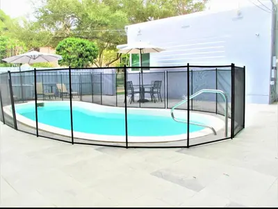 an image of a swimming pool with an open fence at Las Olas 1BR Pool Free Parking Ideal for 2 in Fort Lauderdale