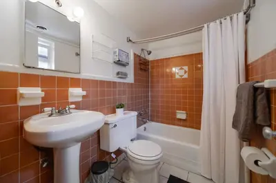 a bathroom with a sink and a toilet and a tub at The mariner Suites #22 - Beachfront Studio in Hollywood