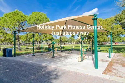 a park fitness center with a playground in a park at Unique Las Olas Stay Pool Free Parking in Fort Lauderdale