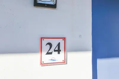 a sign on a wall with the number fortyfour at Beachfront Studio with Pool access -M24 in Hollywood