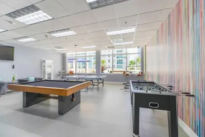a room with two tables and a pool table at Centric 40thFloor Brickell Condo FREE parking by Palermo Home Miami in Miami