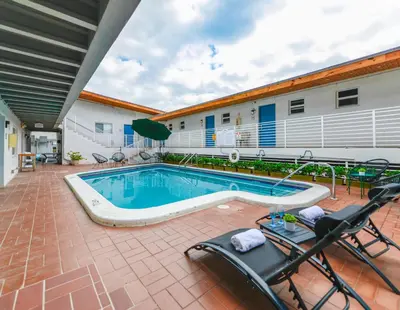 a swimming pool in front of a building at Magical Beach Escape with Pool -M37 in Hollywood