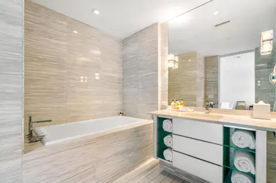 a bathroom with a bath tub and a sink at Ocean View Residence at South Beach -1114 in Miami Beach