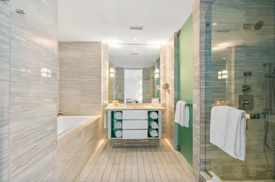a bathroom with a tub and a sink and a shower at Ocean View Residence at South Beach -1114 in Miami Beach