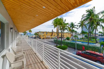a balcony with chairs and a view of a street at Ocean view Balcony with Pool & Parking -M42 in Hollywood