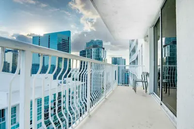 a balcony with a view of the city at Iconic Sunset Views with Pool, Hot tub, GYM, and Parking in Miami