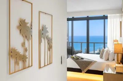 a bedroom with a bed and views of the ocean at PENTHOUSE Ocean View Residence at South Beach - 1926 in Miami Beach