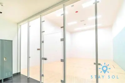 a room with sliding glass doors in a building at Modern Miami Gem - City View Condo - Free Parking in Miami