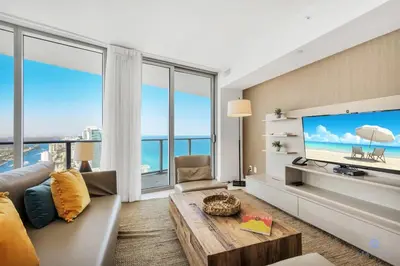 a living room with a large flat screen tv at Insane Ocean View Balcony, Beachfront Resort, Pool in Hollywood