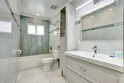 a bathroom with a sink and a toilet and a shower at Spectacular 5BR & 5BA Villa in Hollywood Lakes in Hollywood