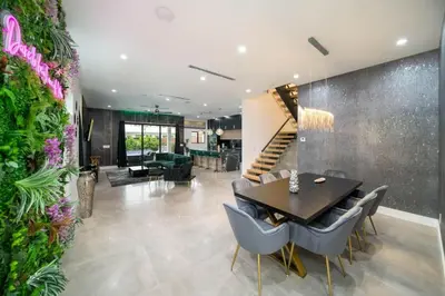 a dining room with a table and chairs at The Elements Luxury Home Fort Lauderdale in Fort Lauderdale