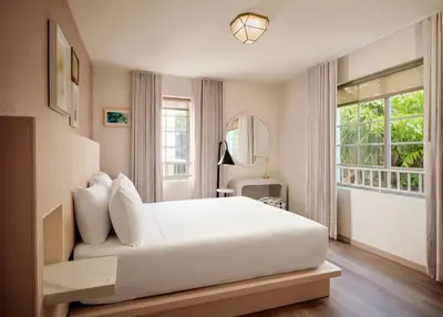 a bedroom with a large white bed and a window at FOUND Hotels, Miami Beach, Series by Marriott in Miami Beach