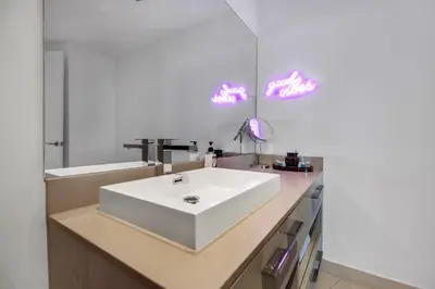 a bathroom with a white sink and a mirror at Hyde Resort Beachfront Condo #1904 - GORGEOUS 2BD & 2BA APT WITH OCEAN VIEW in Hollywood